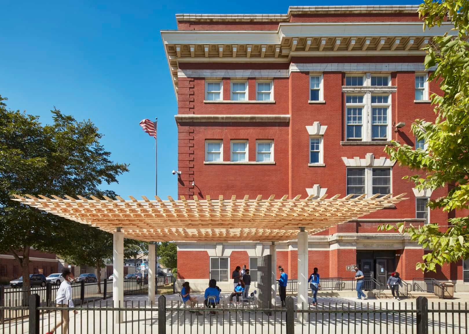 a timber pavilion outside of an elementary school
