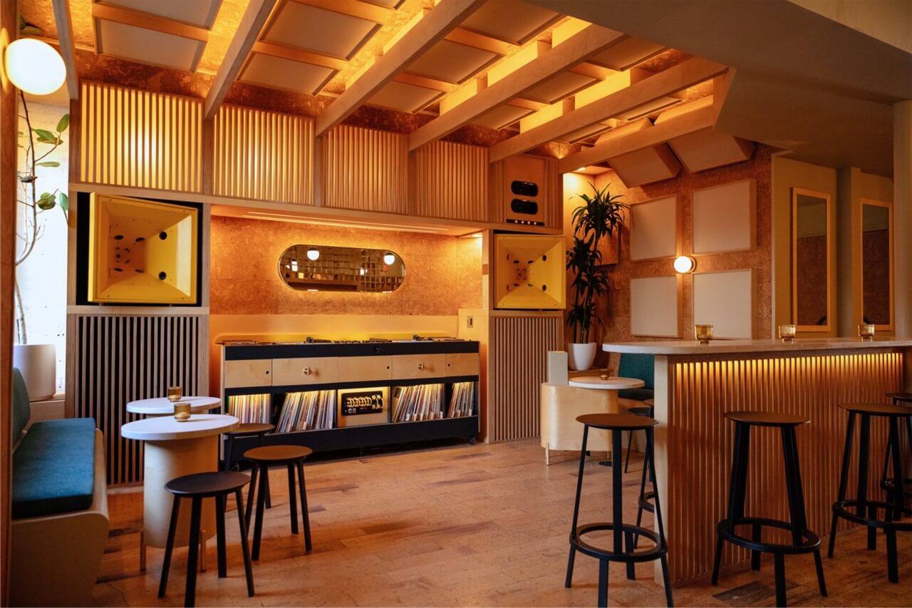 a wood paneled listening room in a bar space