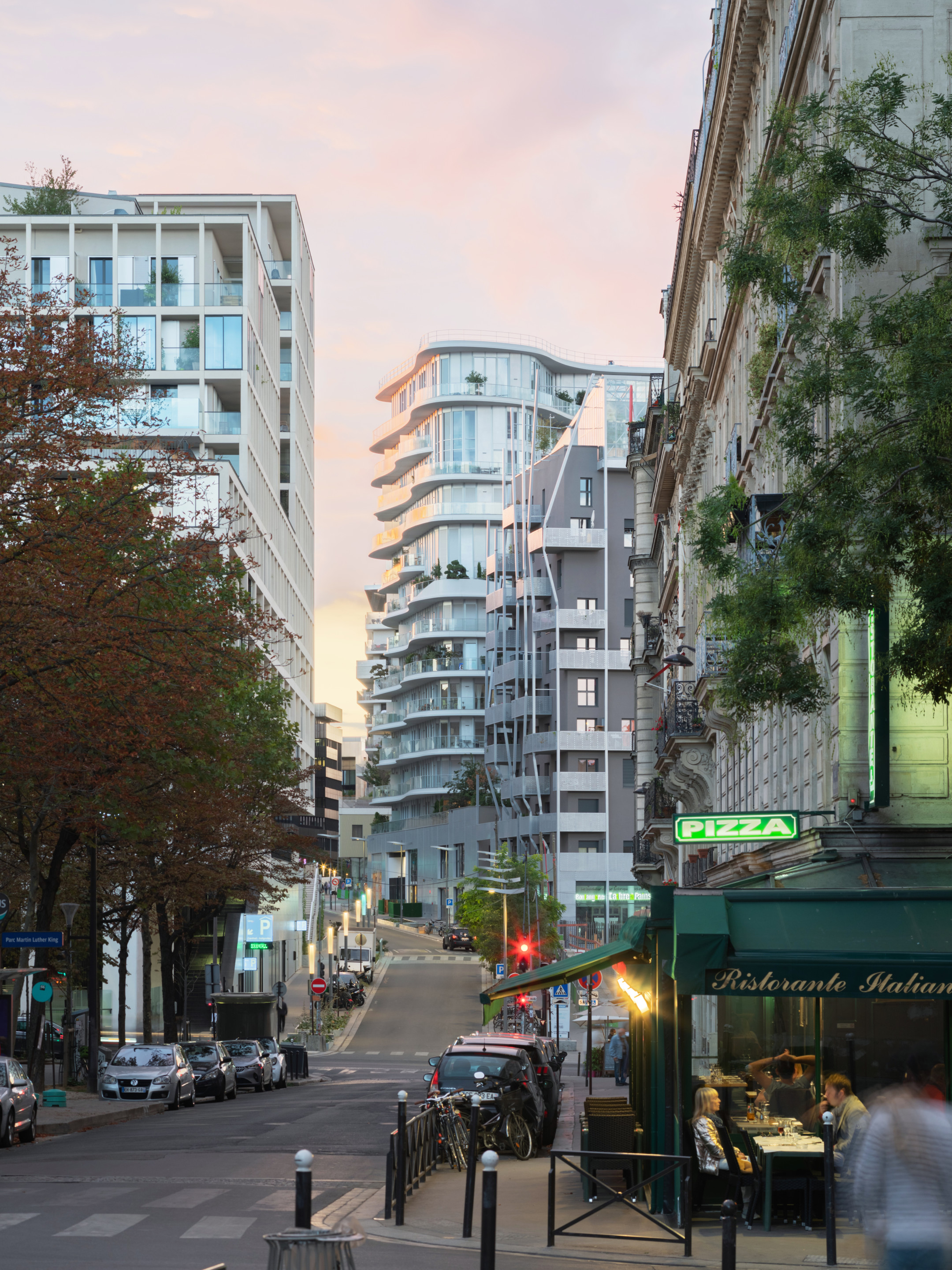 view of a parisian residential street with a mix of new and old buildings