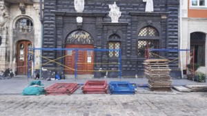 construction supplies in front of black building