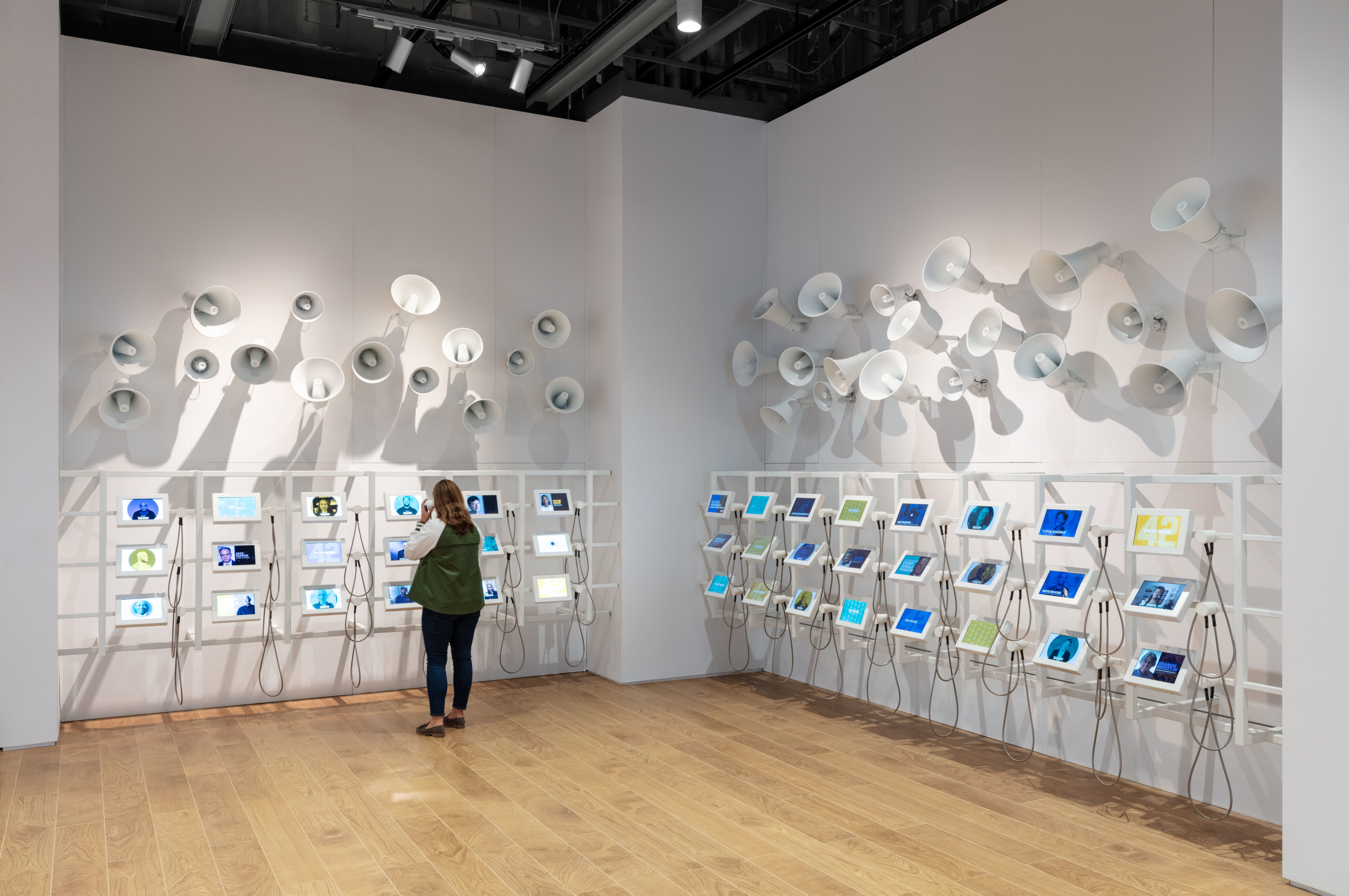 an immersive museum exhibit with mounted megaphones