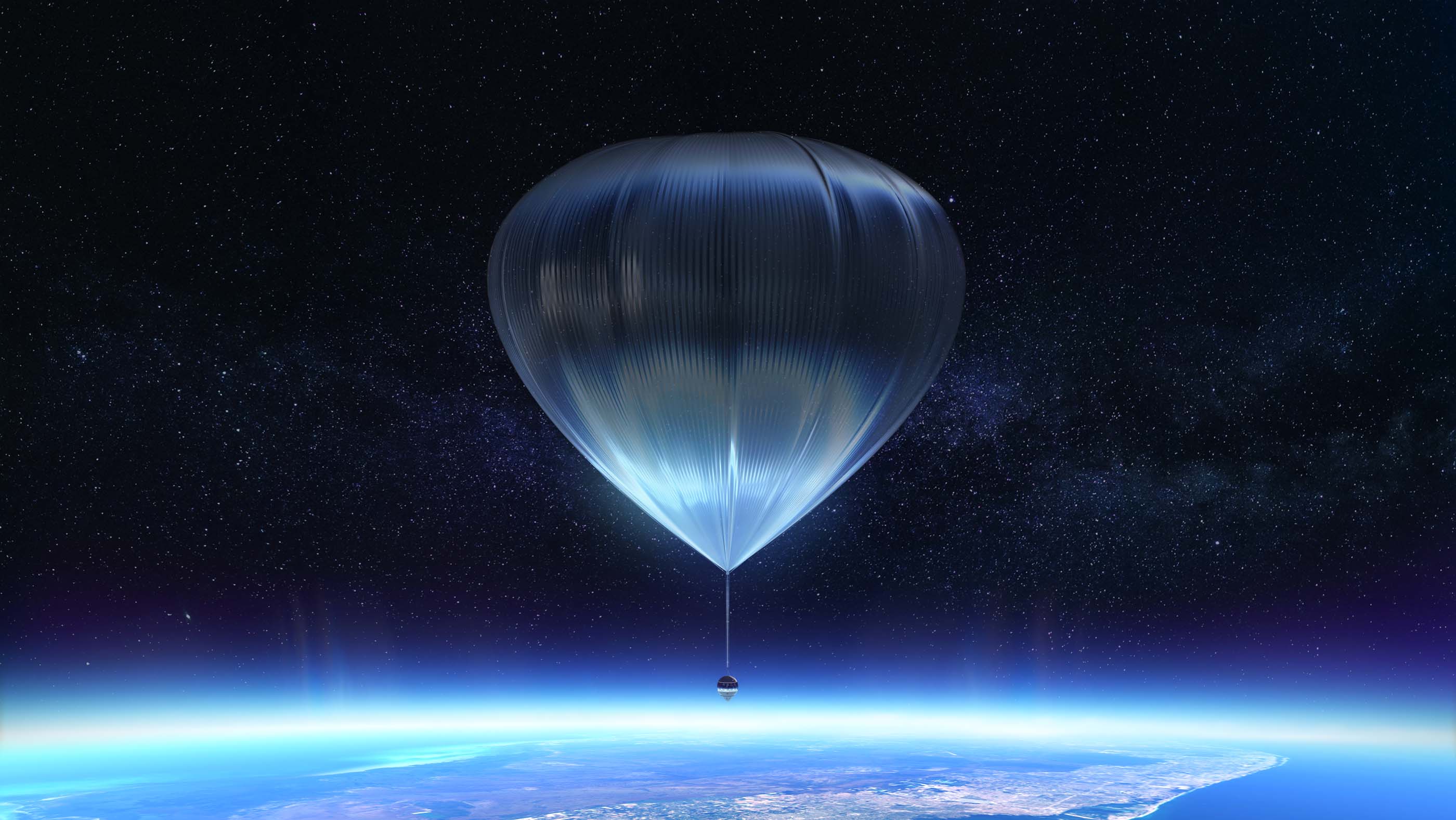 large balloon lifts spacecraft above earth surface