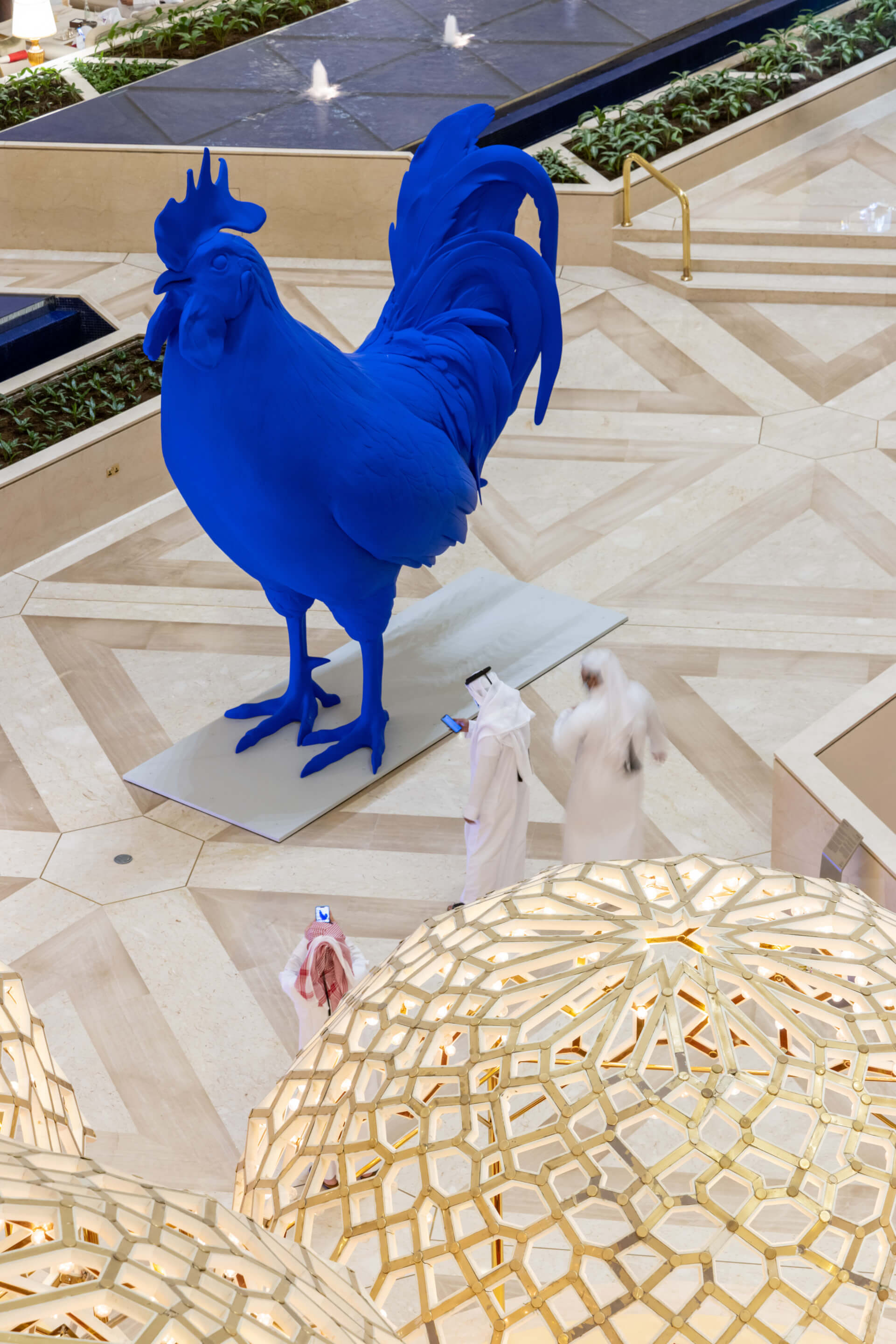 a giant blue chicken sculpture