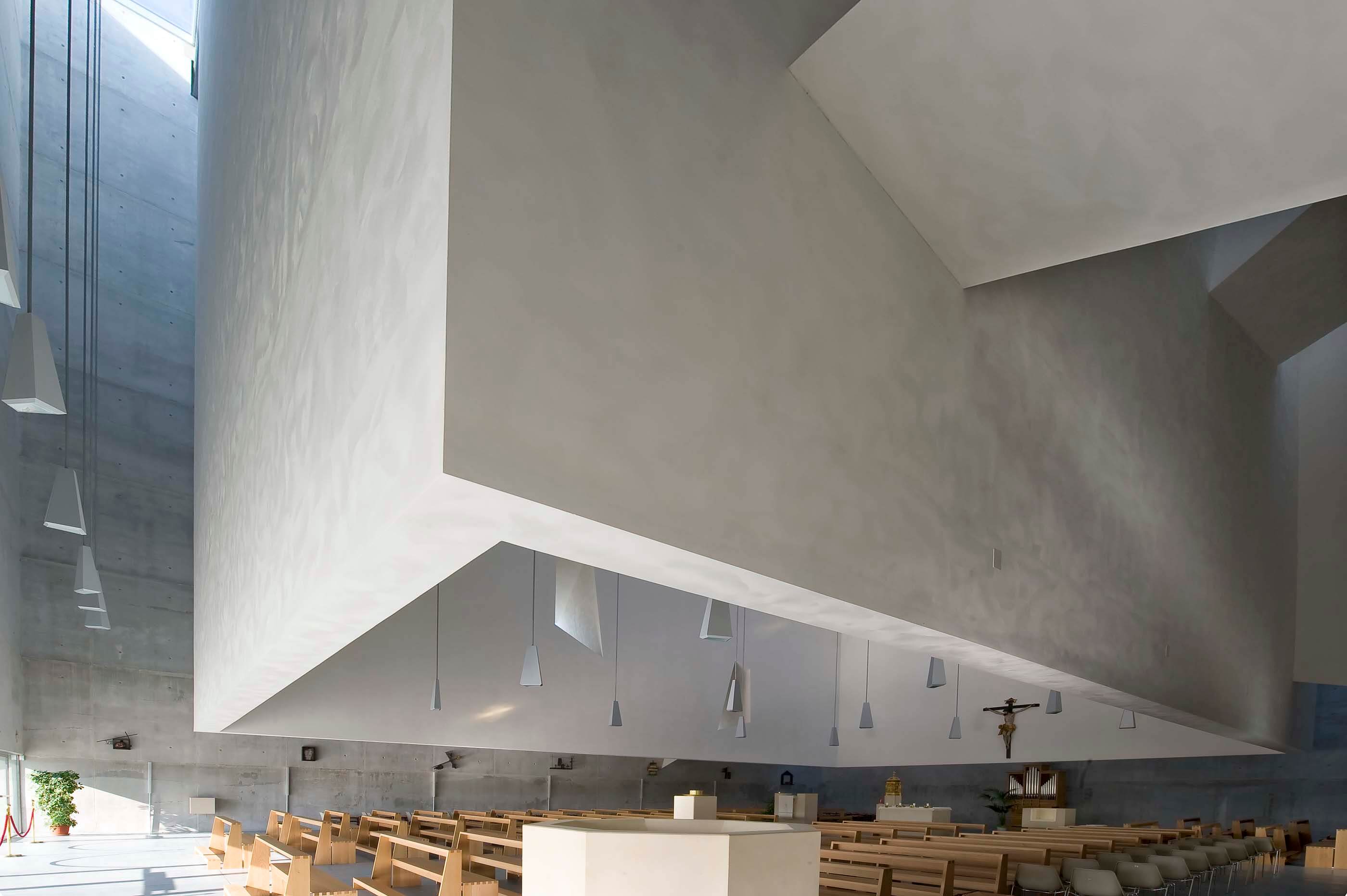 angular concrete volume suspended from ceiling