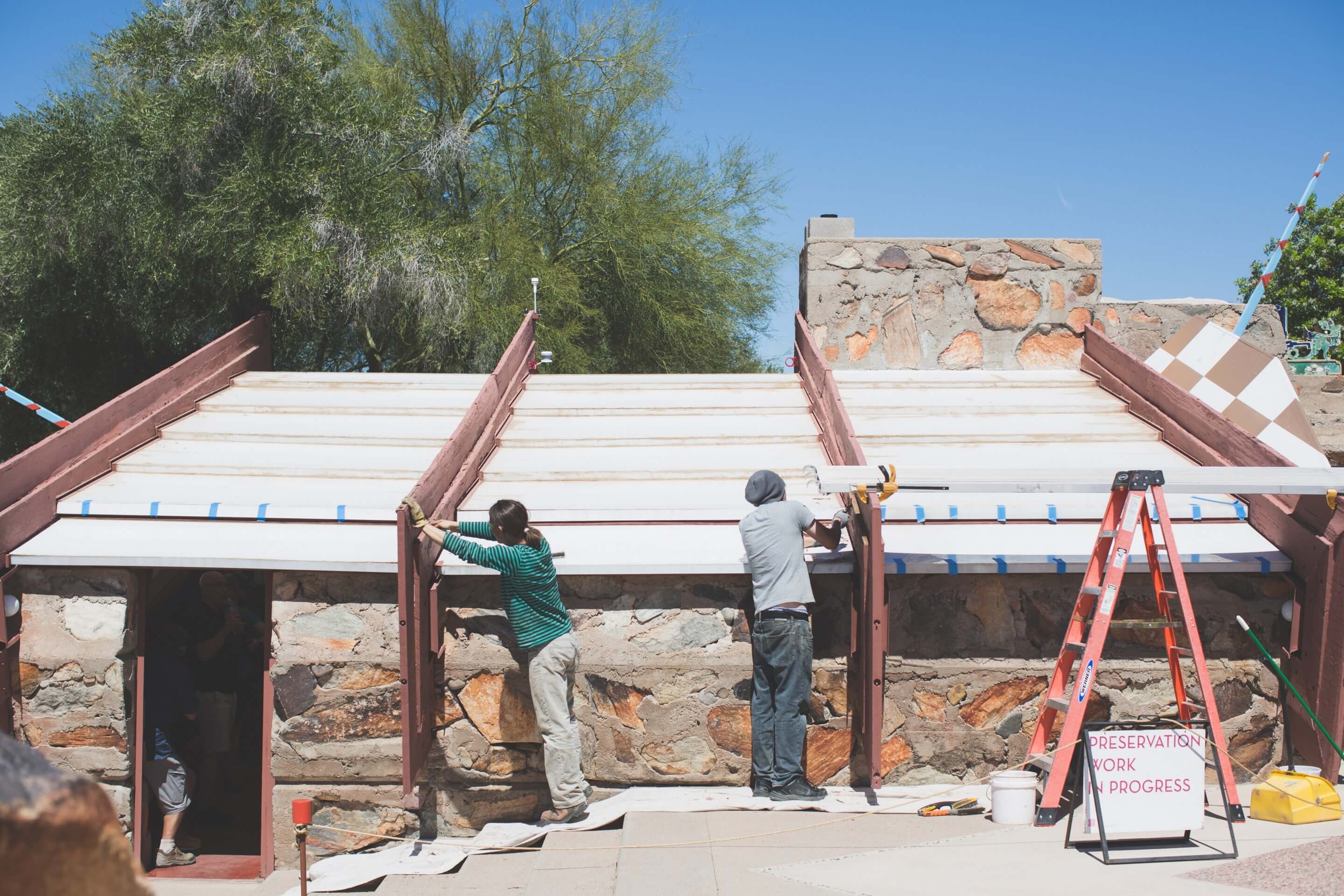 a team investigates a roof structure at a frank lloyd wright building