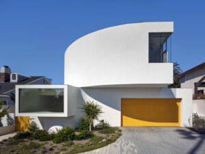 a modern home with a yellow garage door in LA