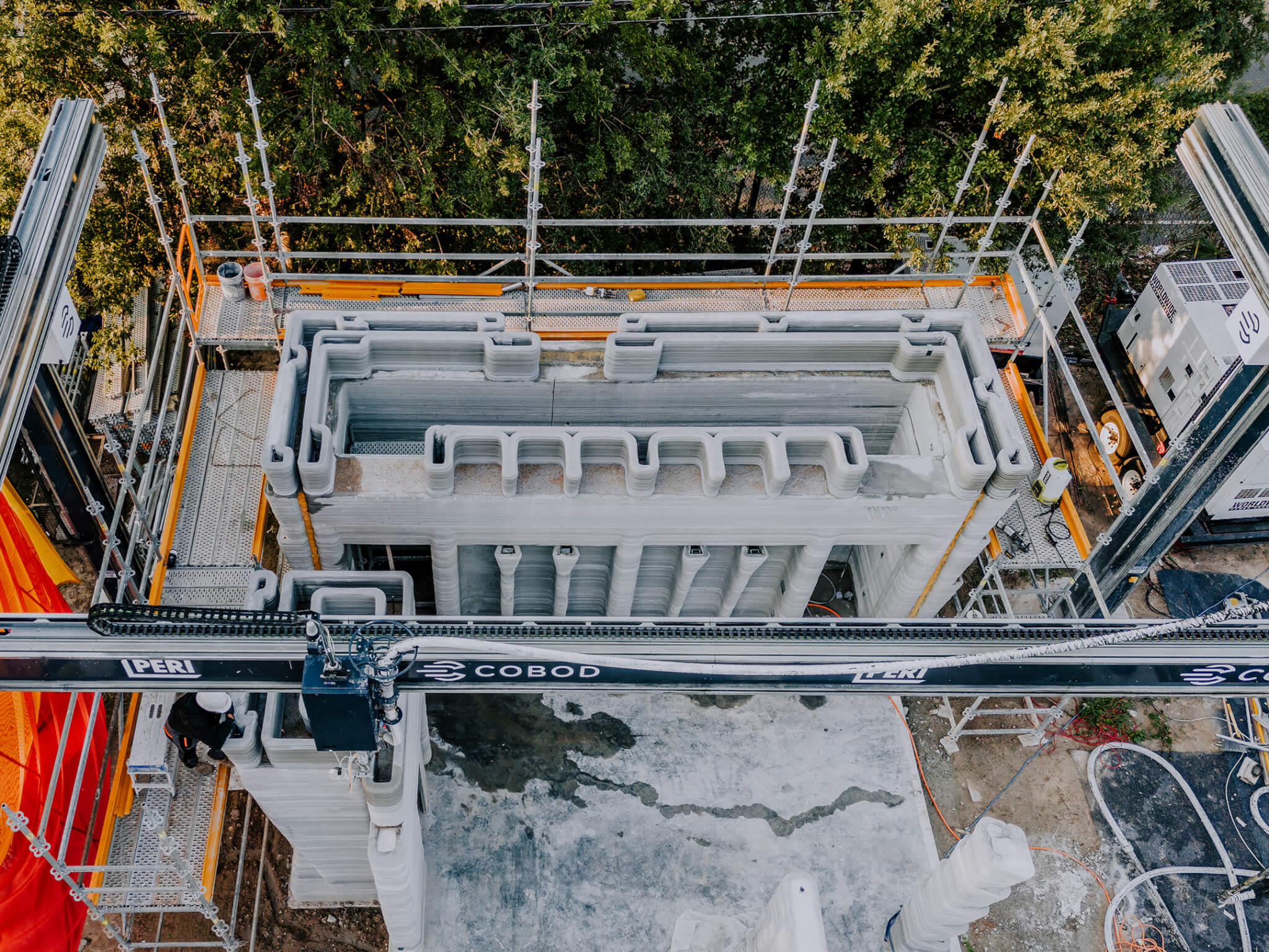 overhead view of a construction site with a large 3d printer