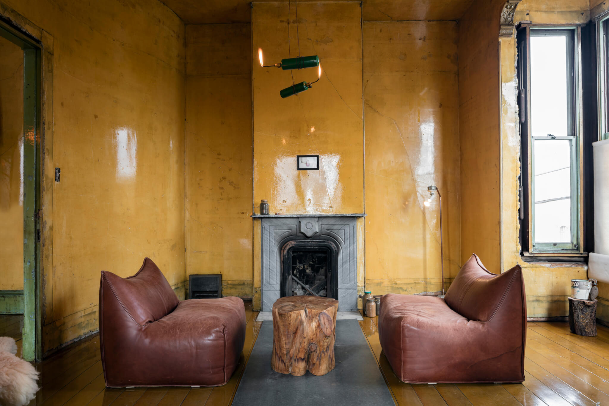 a seating area next to a large hearth