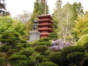red pagoda in lush green landscape