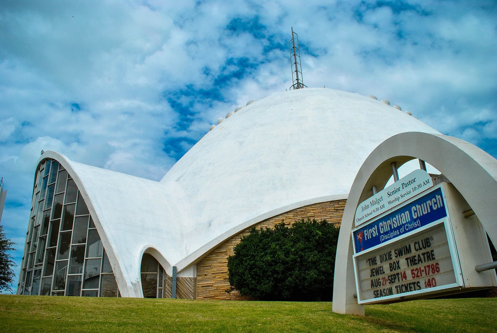 a modernist church with a concrete dome