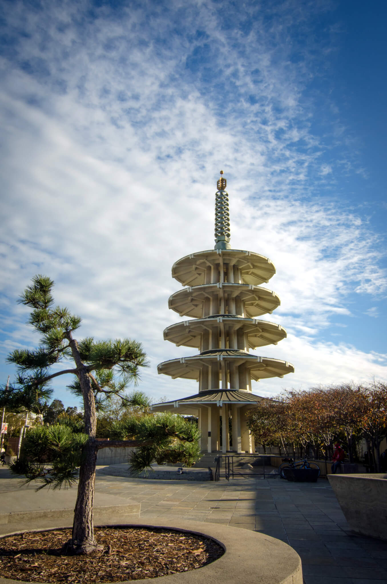 a concrete pagoda in a park
