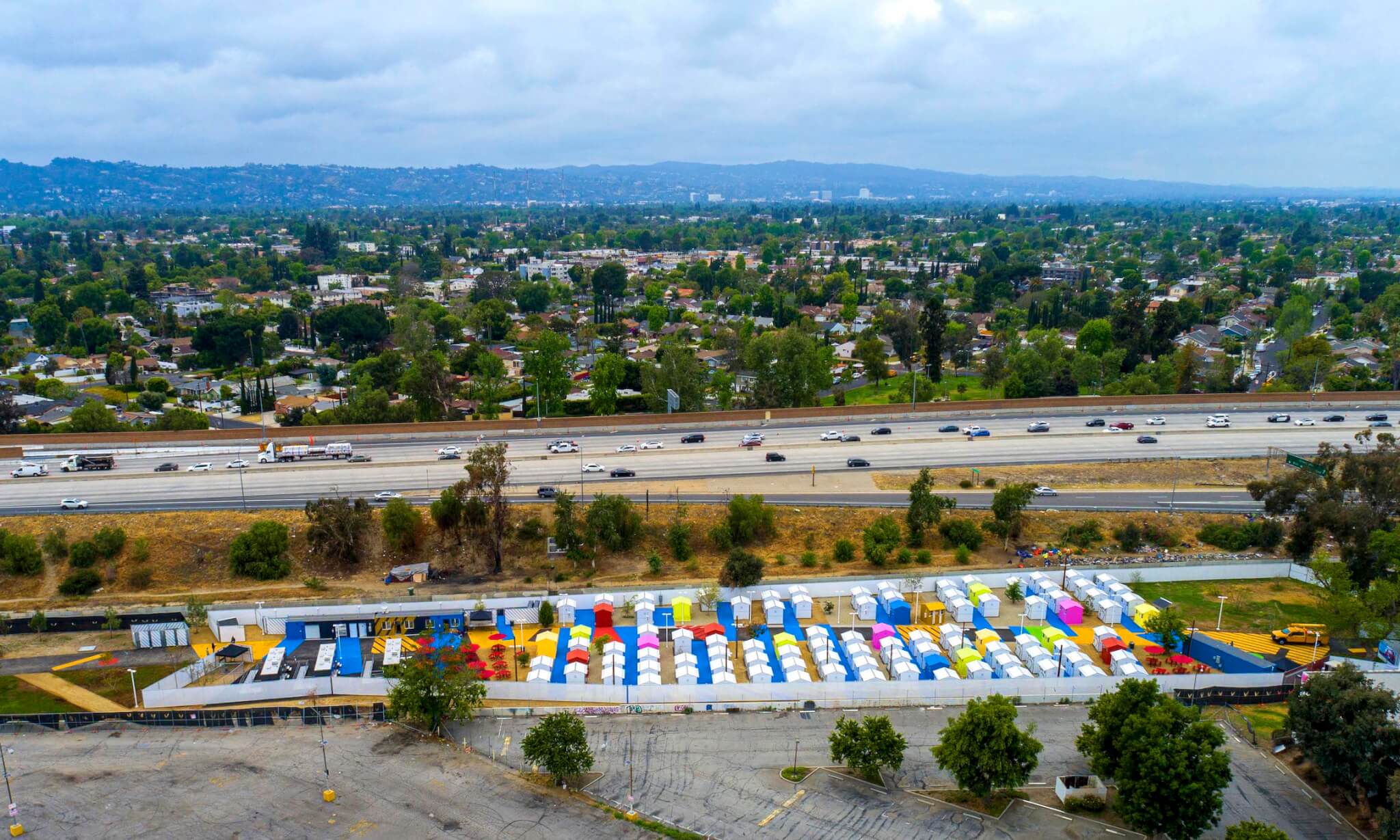 overhead view of a tiny house village next to a freeway in L.A.