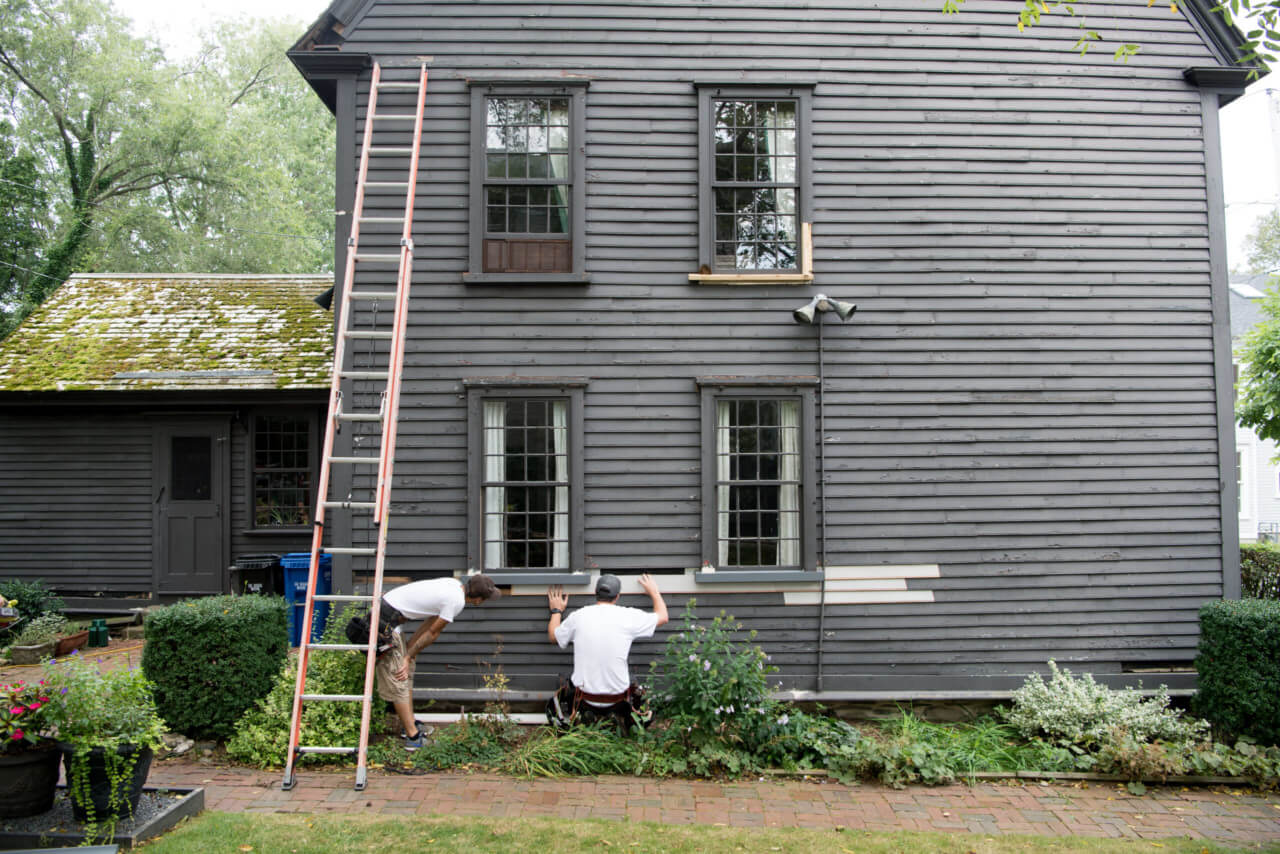 Workers restore historic home