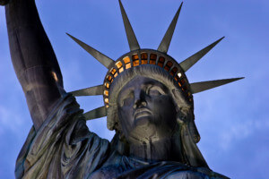 detail view of the statue of liberty head and crown at night