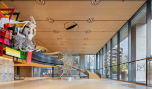 view of an office tower lobby with large sculptural artworks