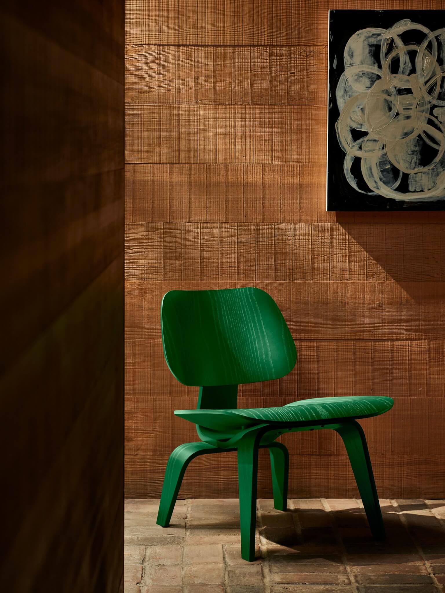 green chair against brown background