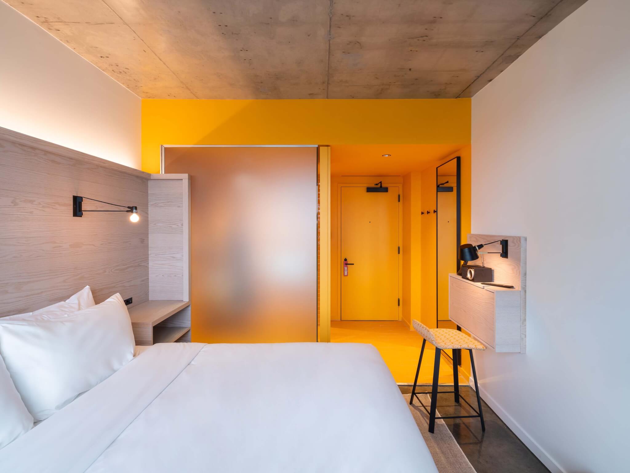 hotel room with yellow walls