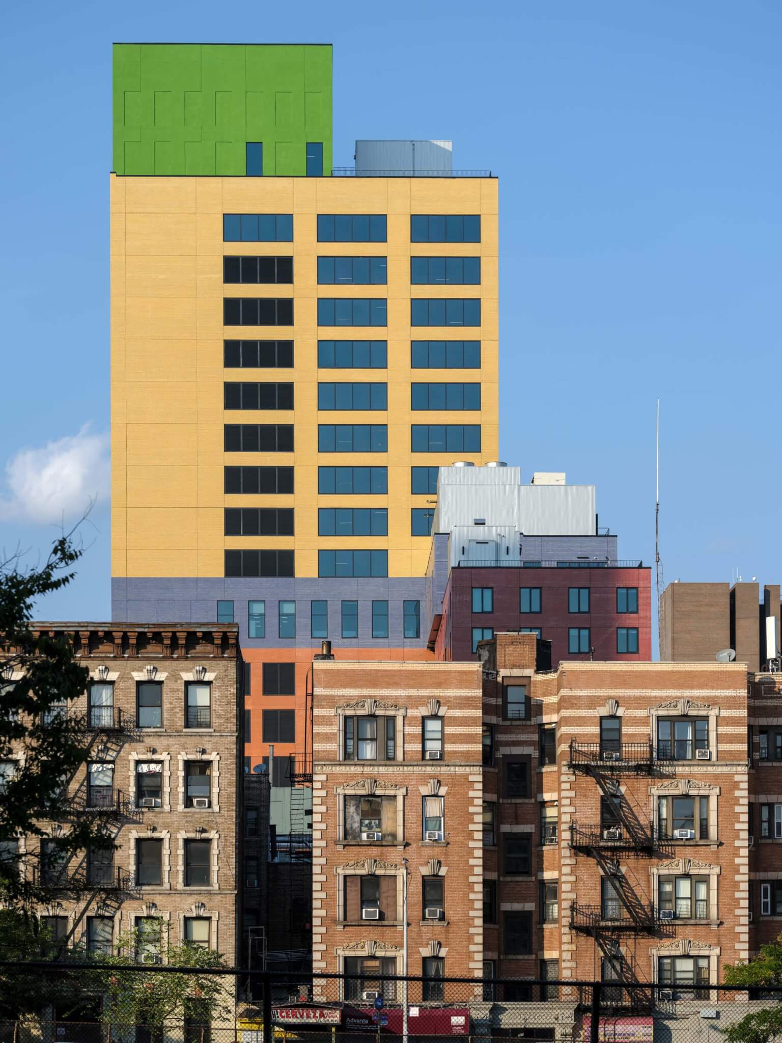 view of pre-war buildings with colorful building in back