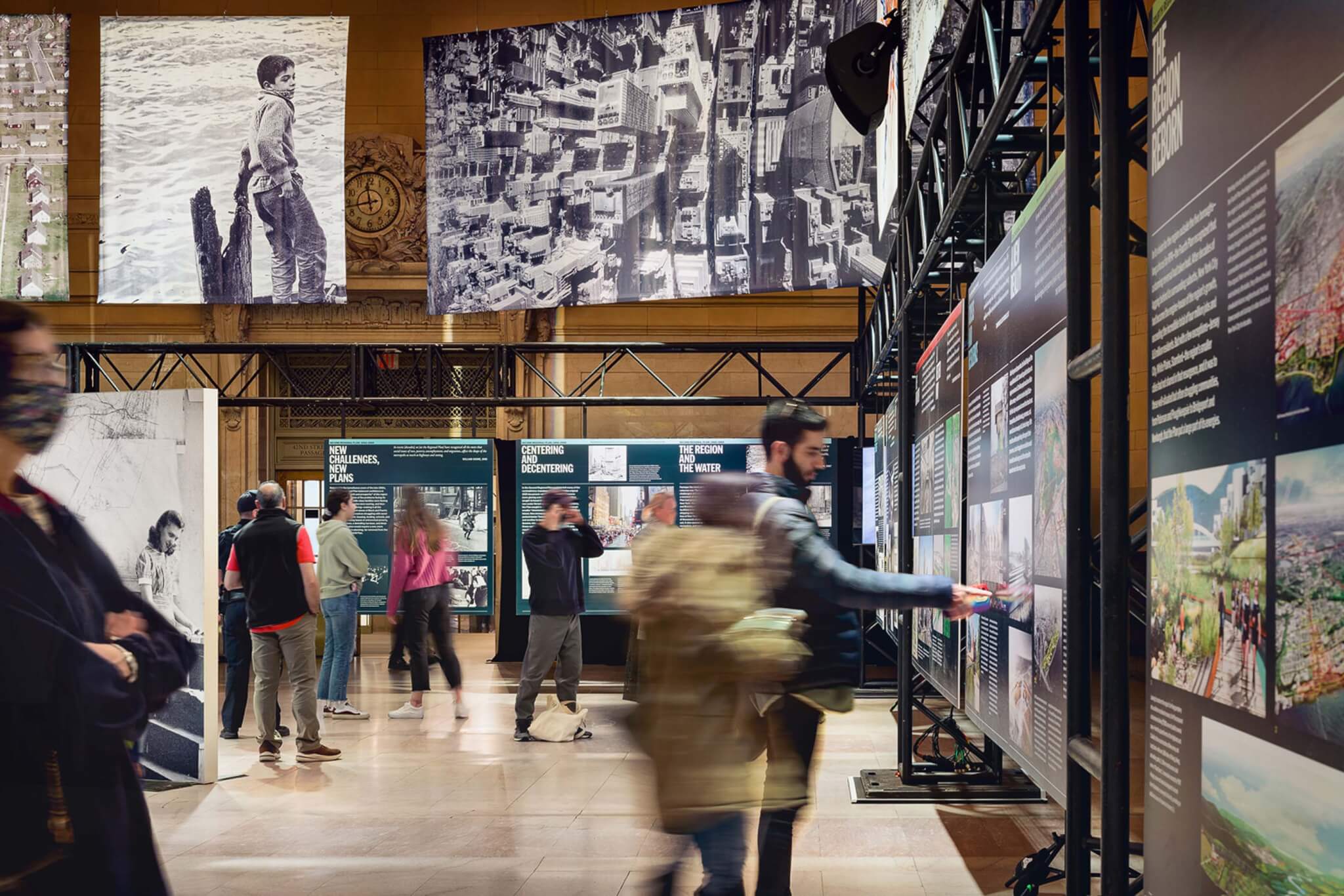 people viewing posters in exhibition