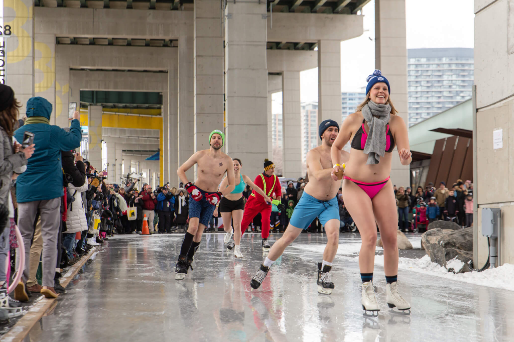 people in underpants ice skate on an outdoor trail