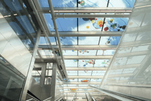 glass skylights with colorful art installation