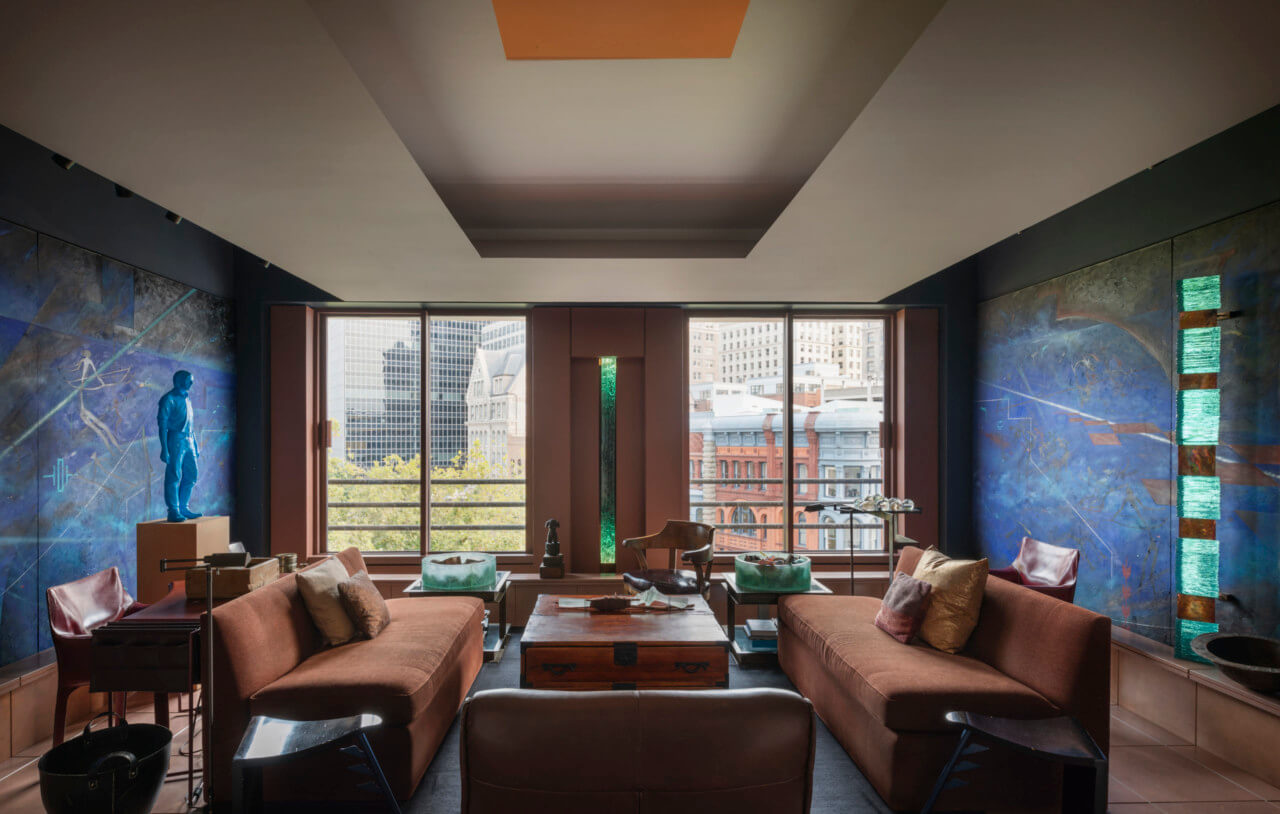 living room with brown couches and city view