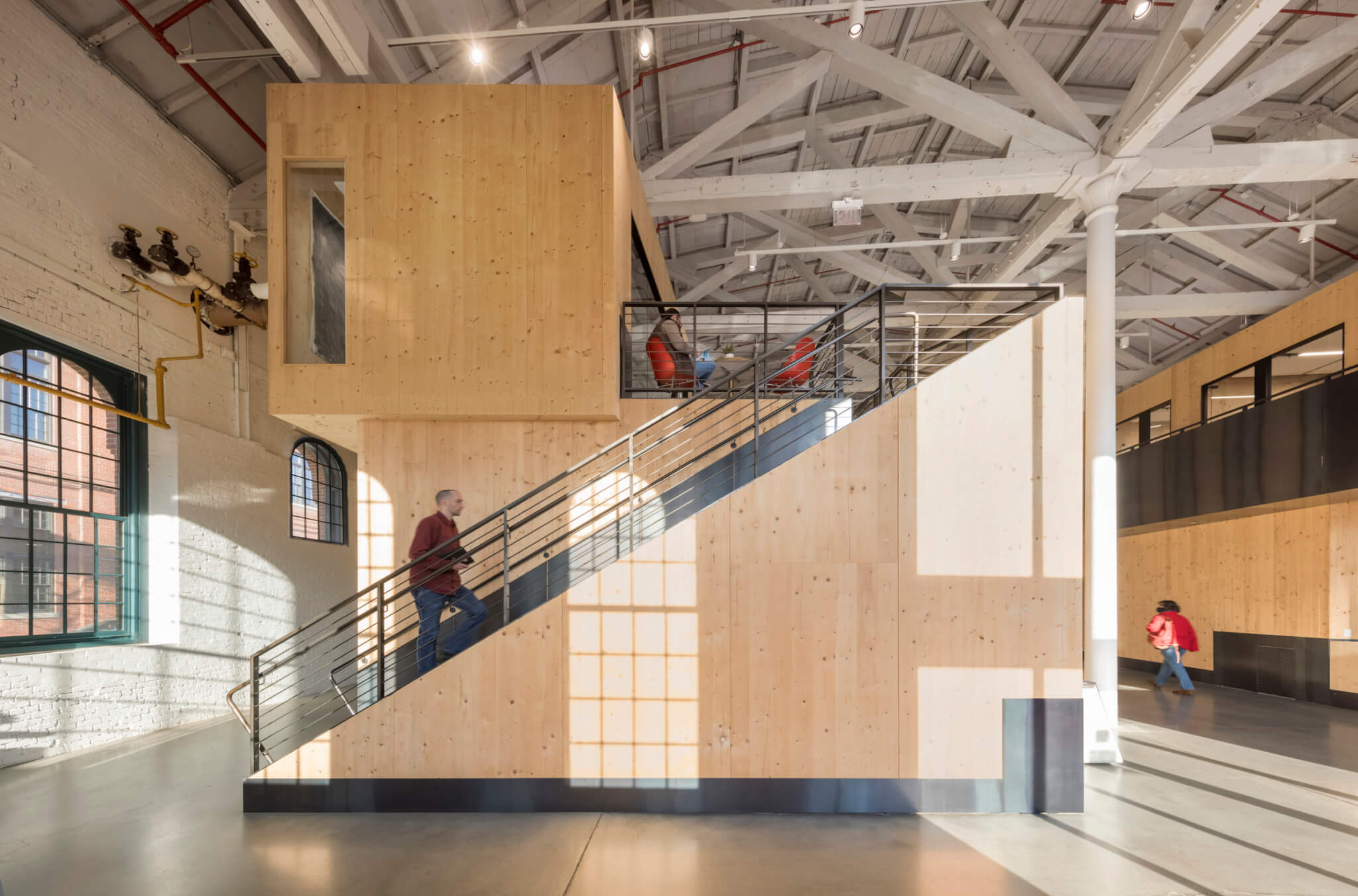 a modern factory space made up of stacked engineered wood modules