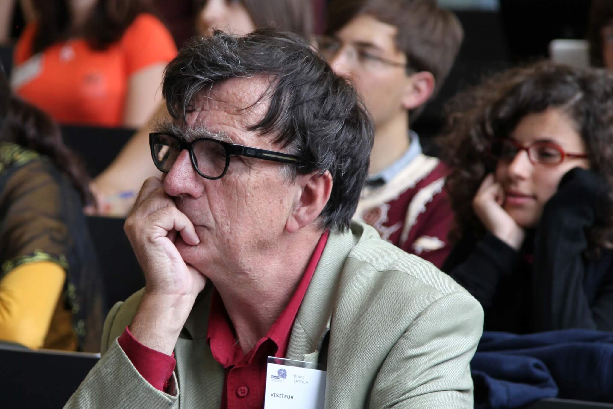 bruno latour sits pensively in an audience