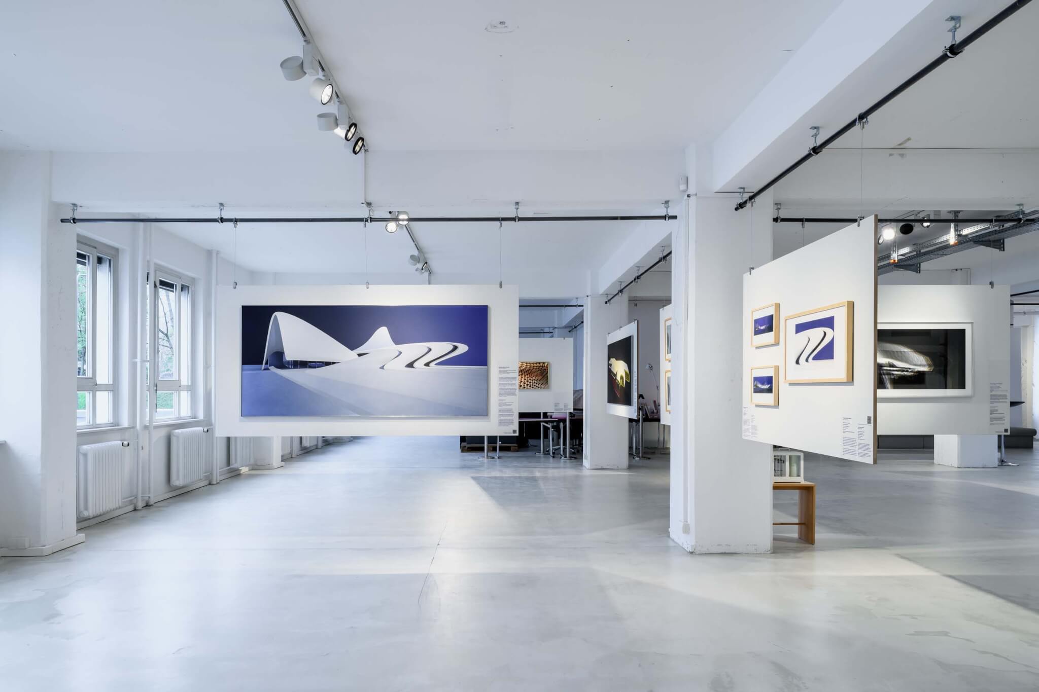 view of exhibition space with architectural drawings on display