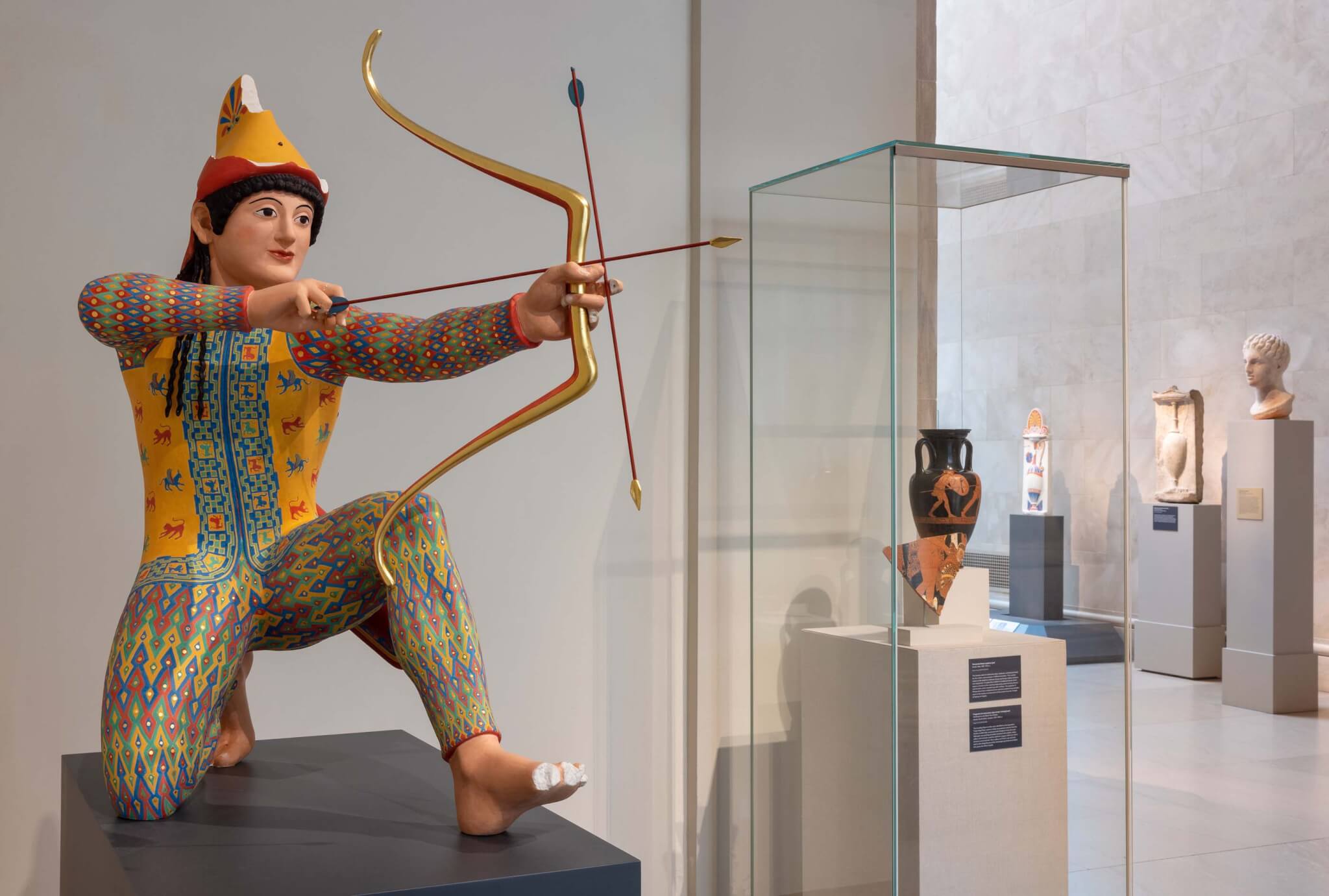 colored reconstruction of archer statue