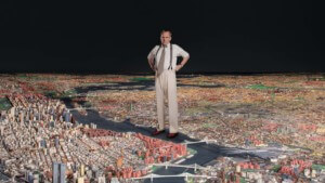 actor playing robert moses stands over graphic map