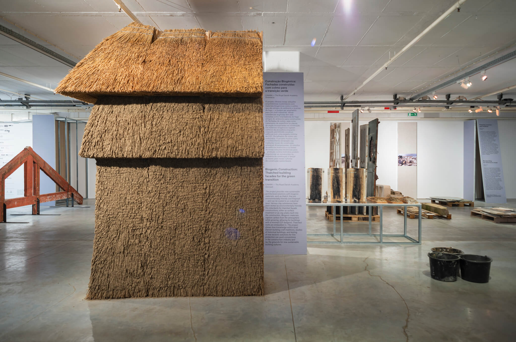 model of building constructed with earthen materials on show in exhibition space