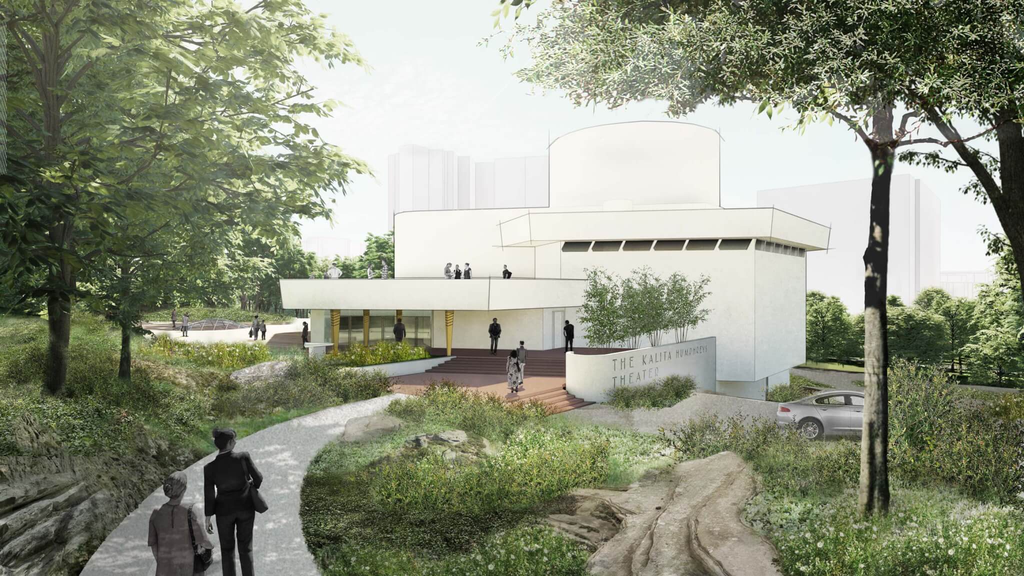 rendering of white theater building with lush green landscape