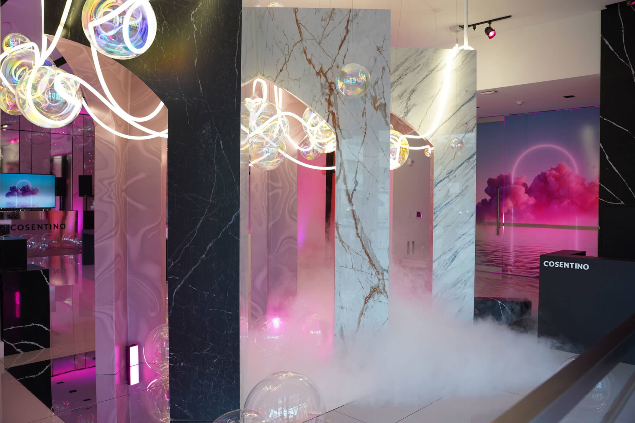 marble archways with pink lights and smoke