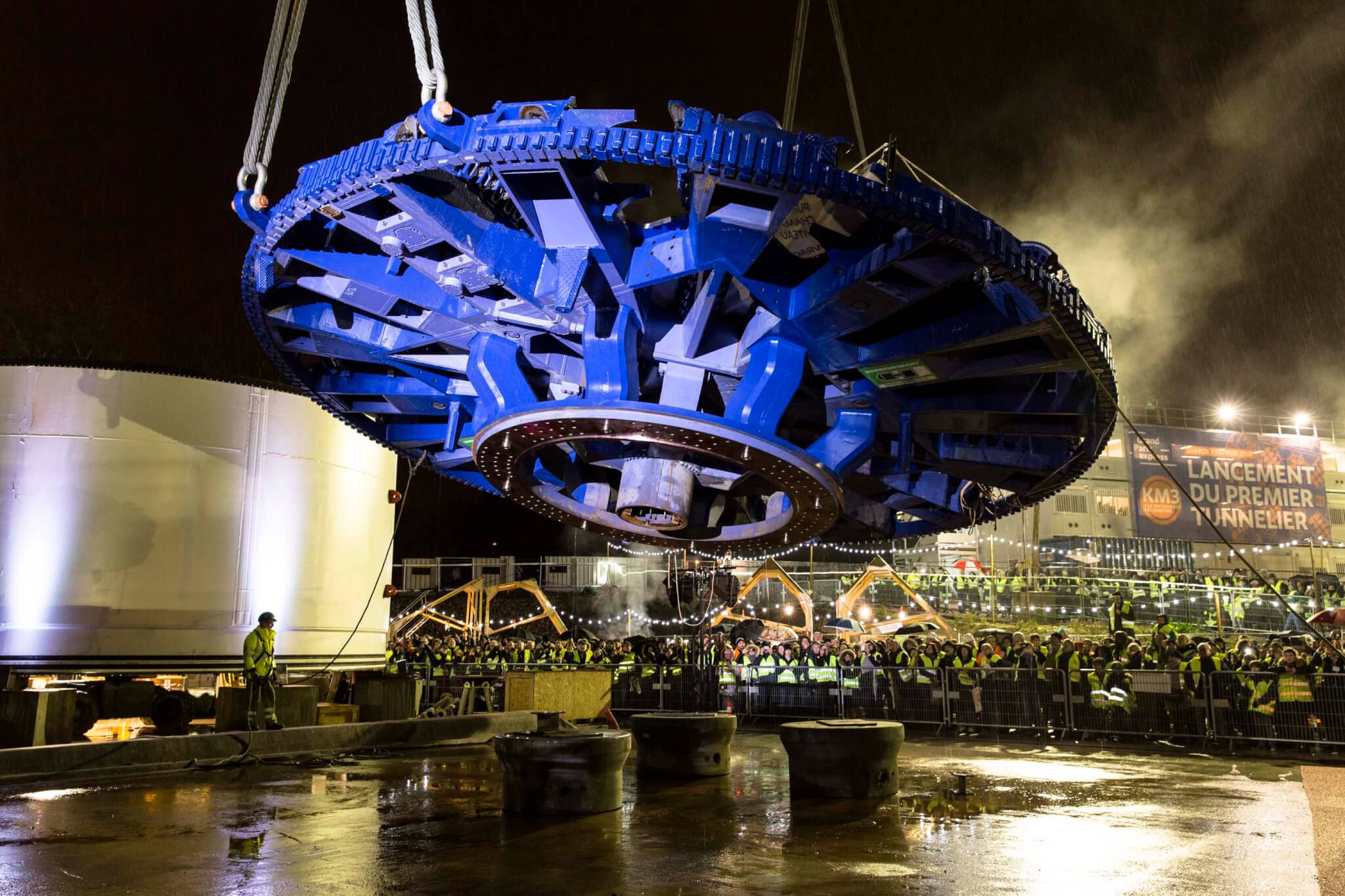 large blue tunneler being hoisted into place