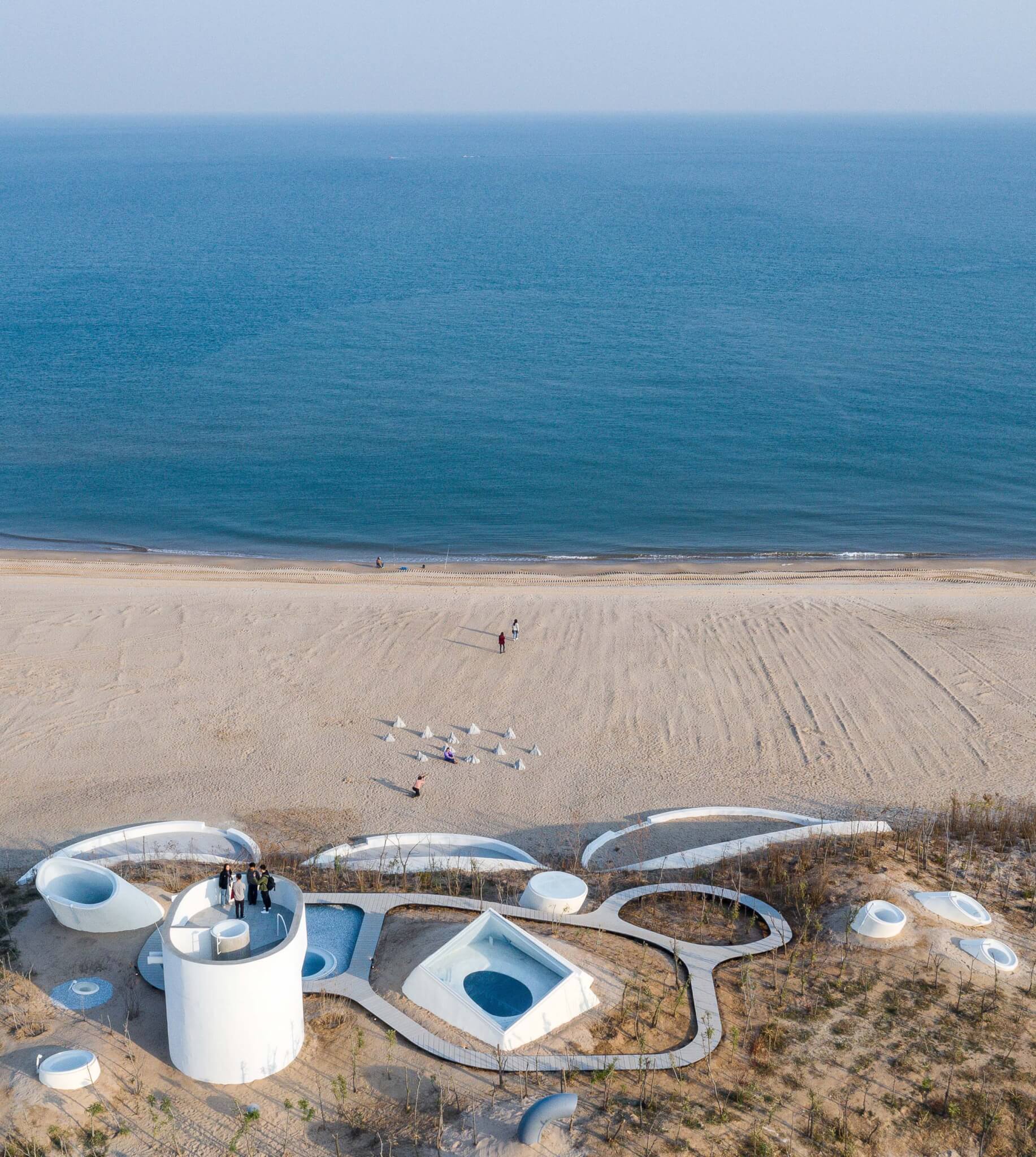 museum built into dune on beach