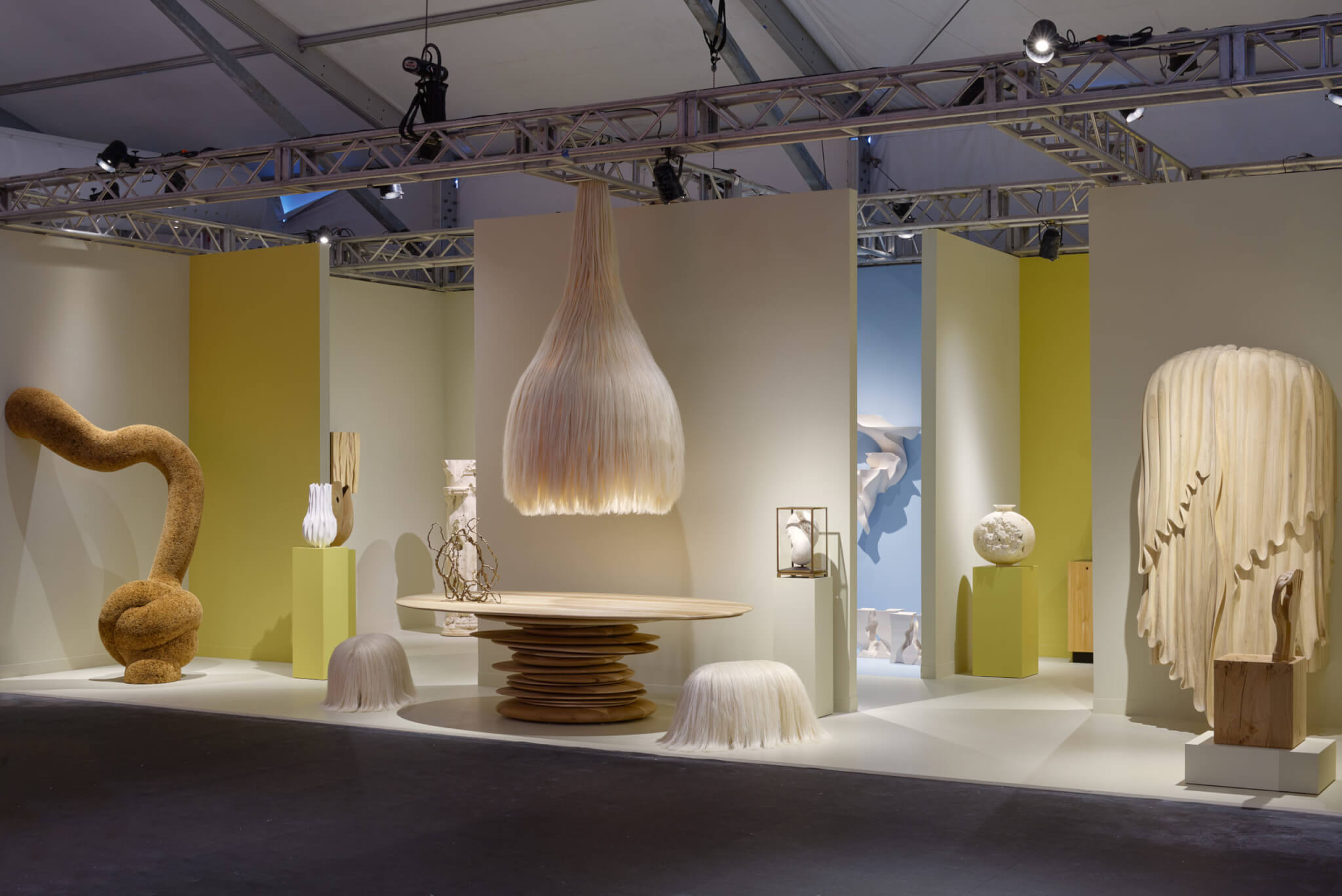 oddly shaped light fixtures and furnishings staged in exhibition space