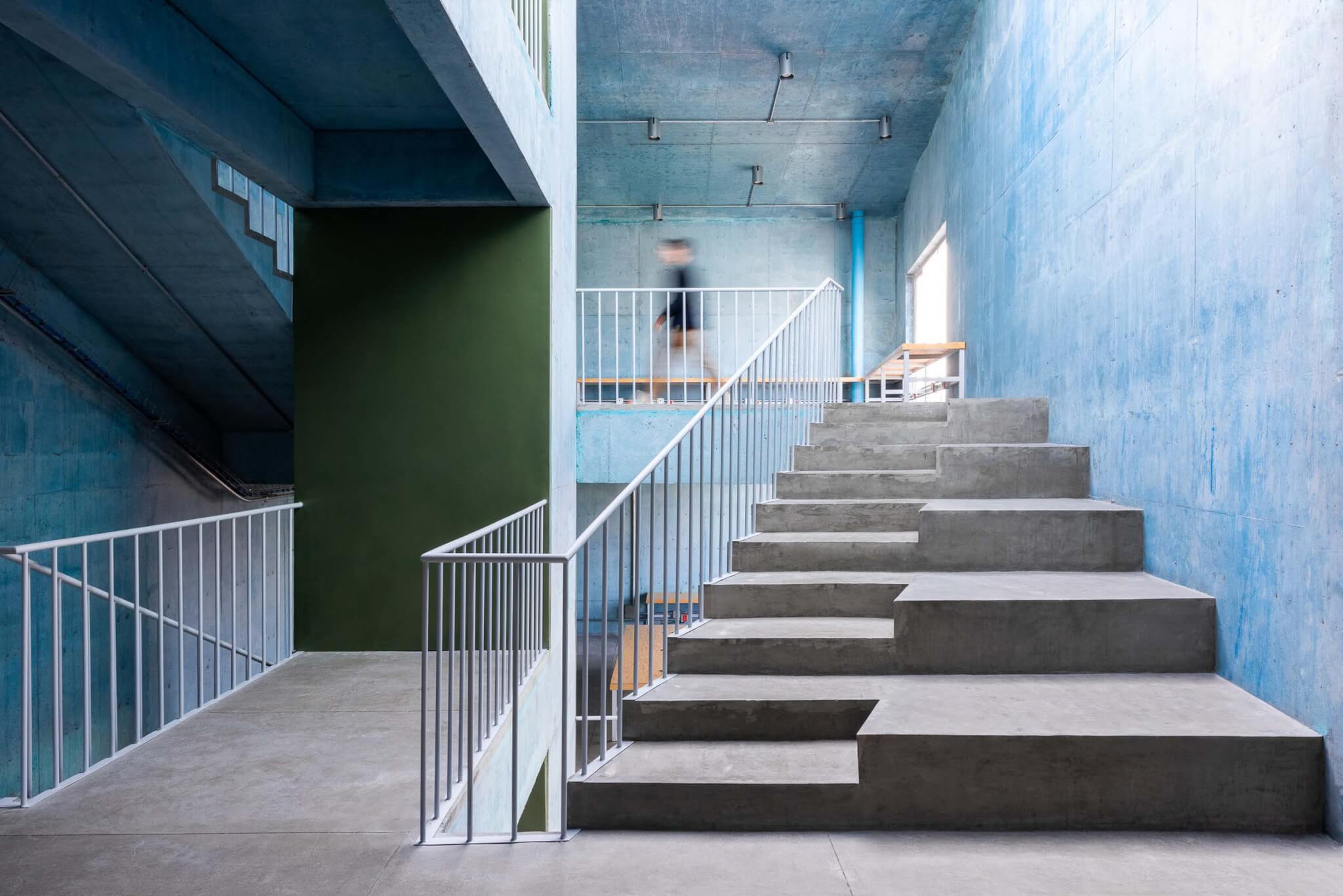 concrete staircases with metal railings