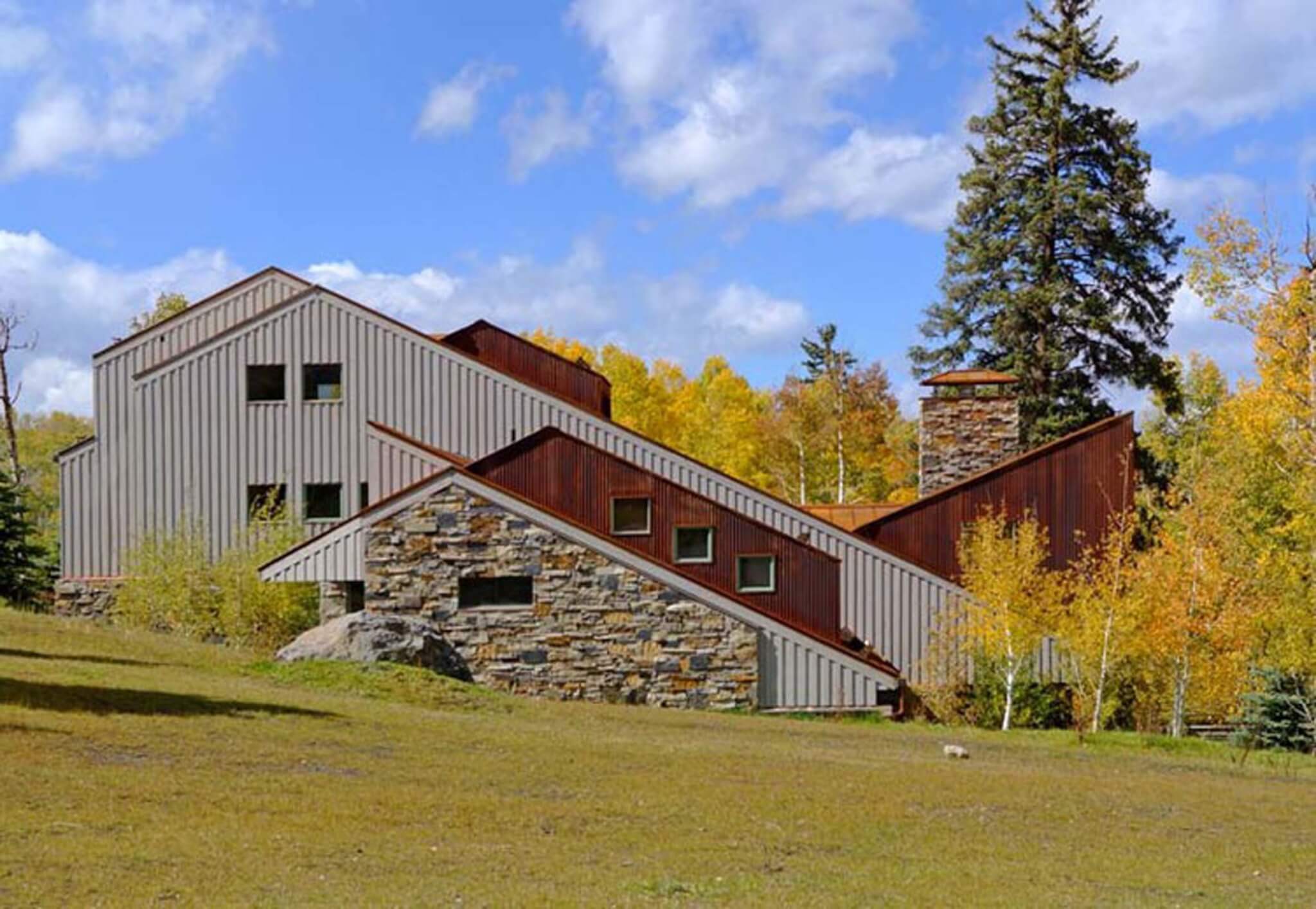 house in colorado with corten steel and stone facades