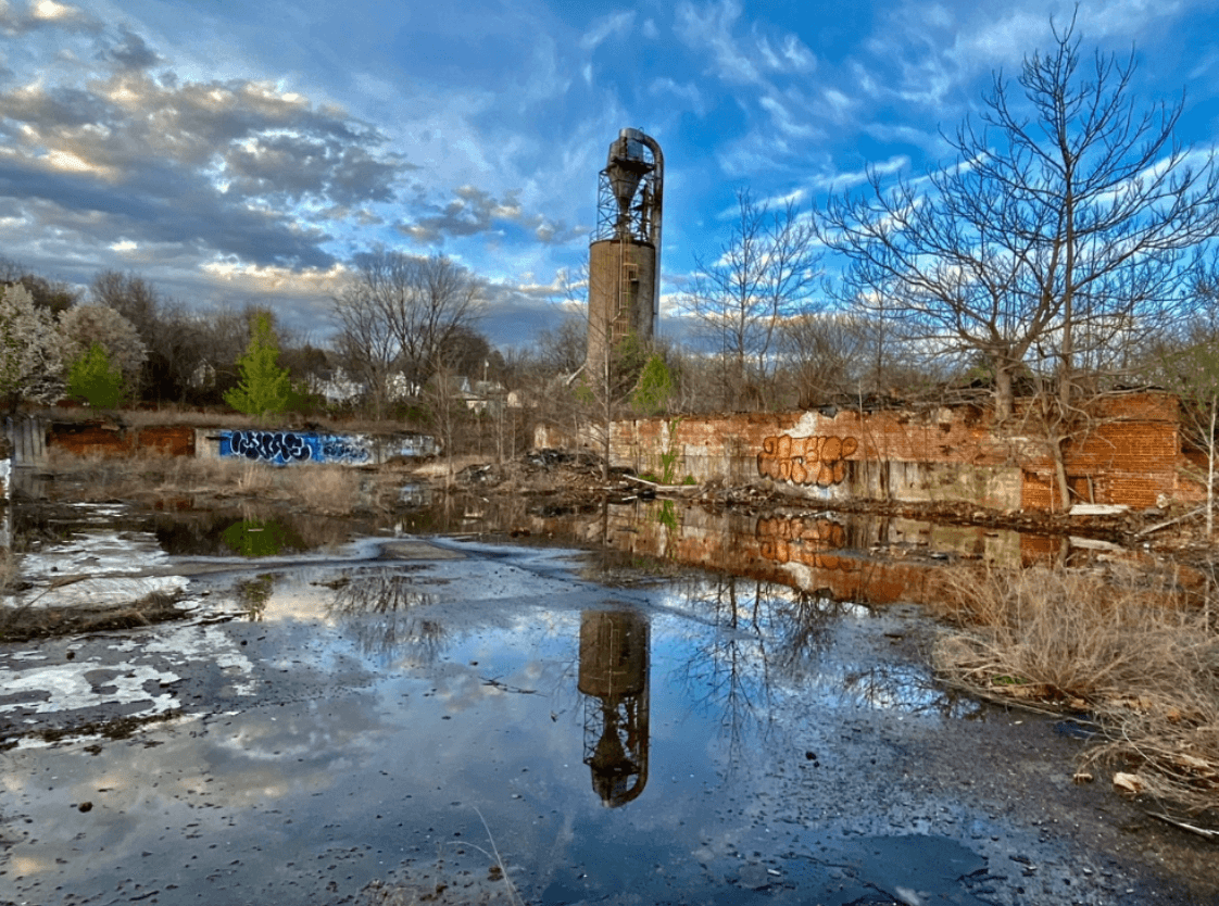blue sky and waterway with brick tower