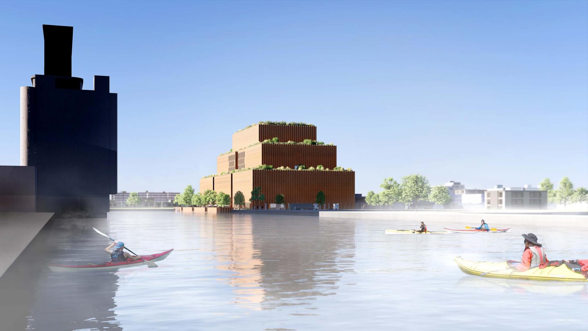 water with kayakers and building