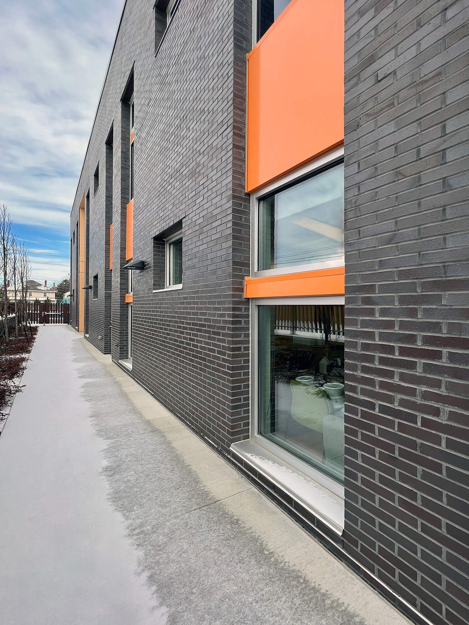 glass on gray brick exterior