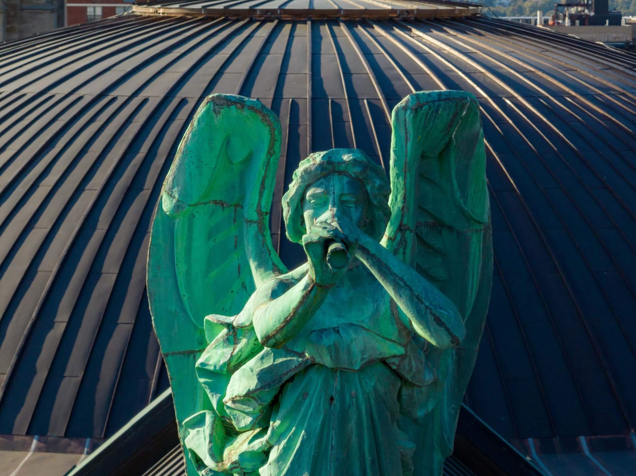 close up of gabriel statue on roof of st johns the divine