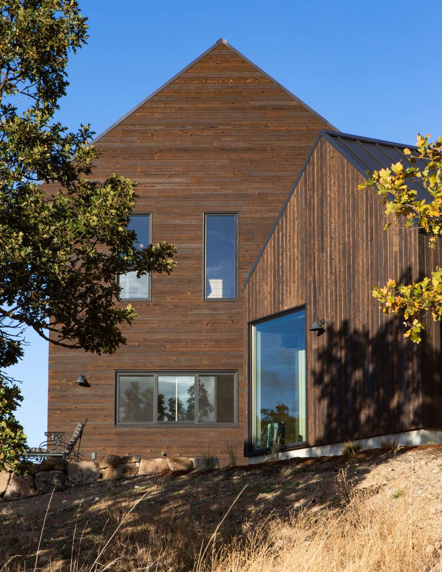A wood-clad house on the ledge