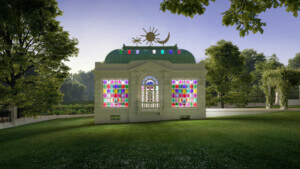 A chapel-like strcuture with beaux-arts style featuring colorful glass stained panels that allow light to peek through.