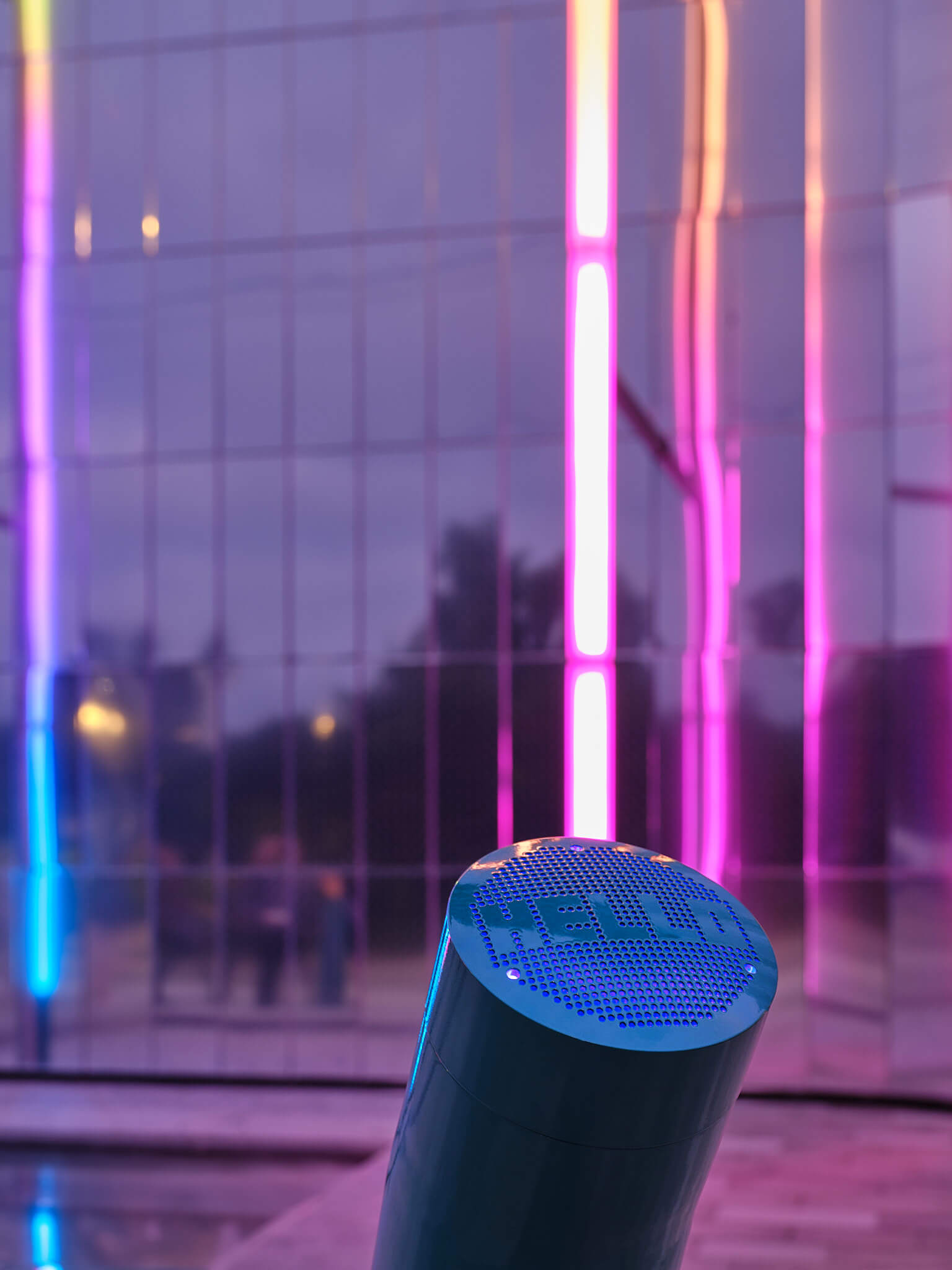 a microphone tube that reads the word "hello" with a luminescent background