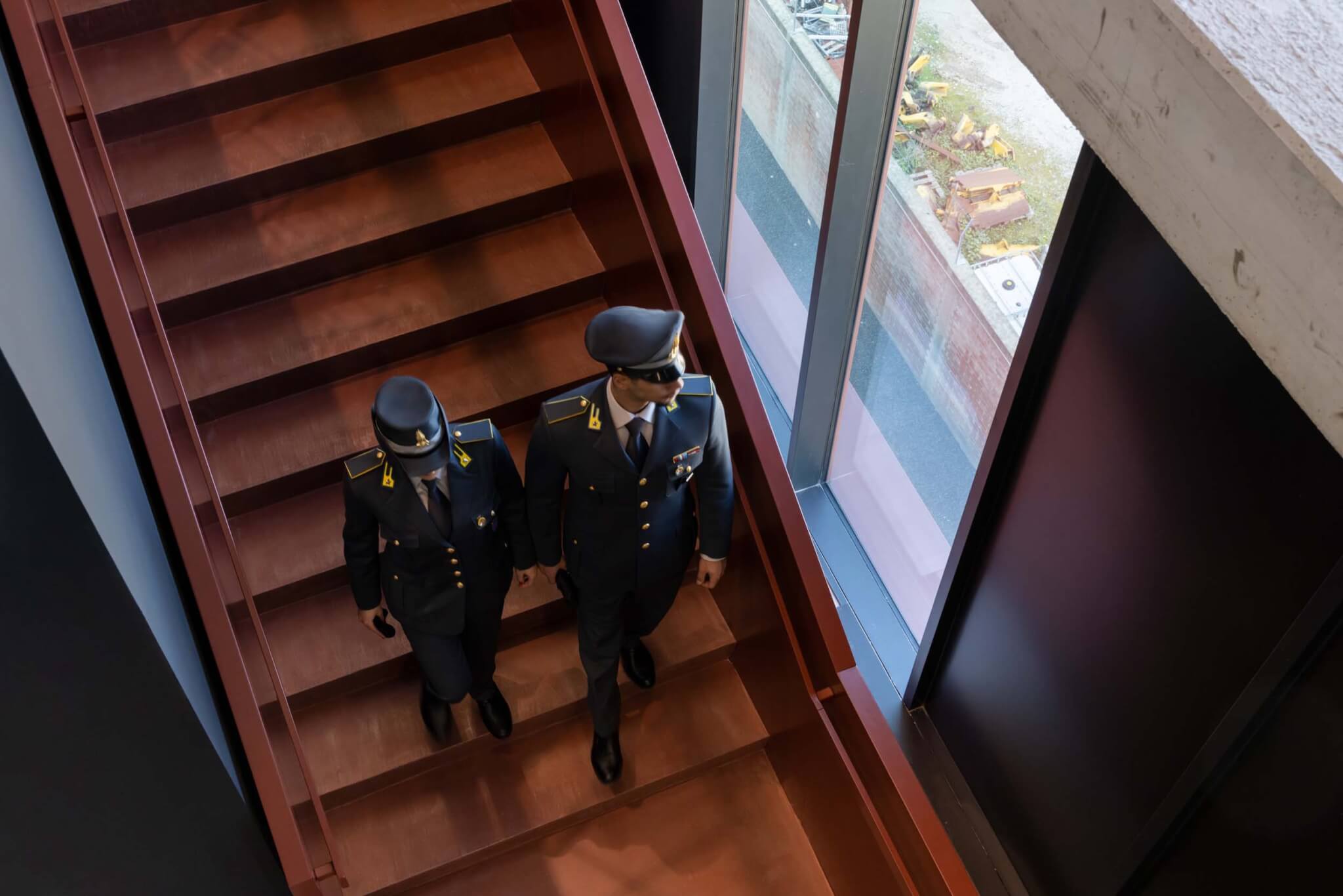 two officers walk down stairs