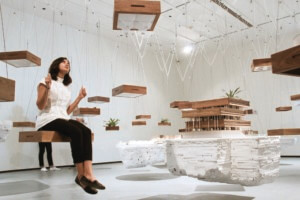woman on swing in an installation by The Open Workshop