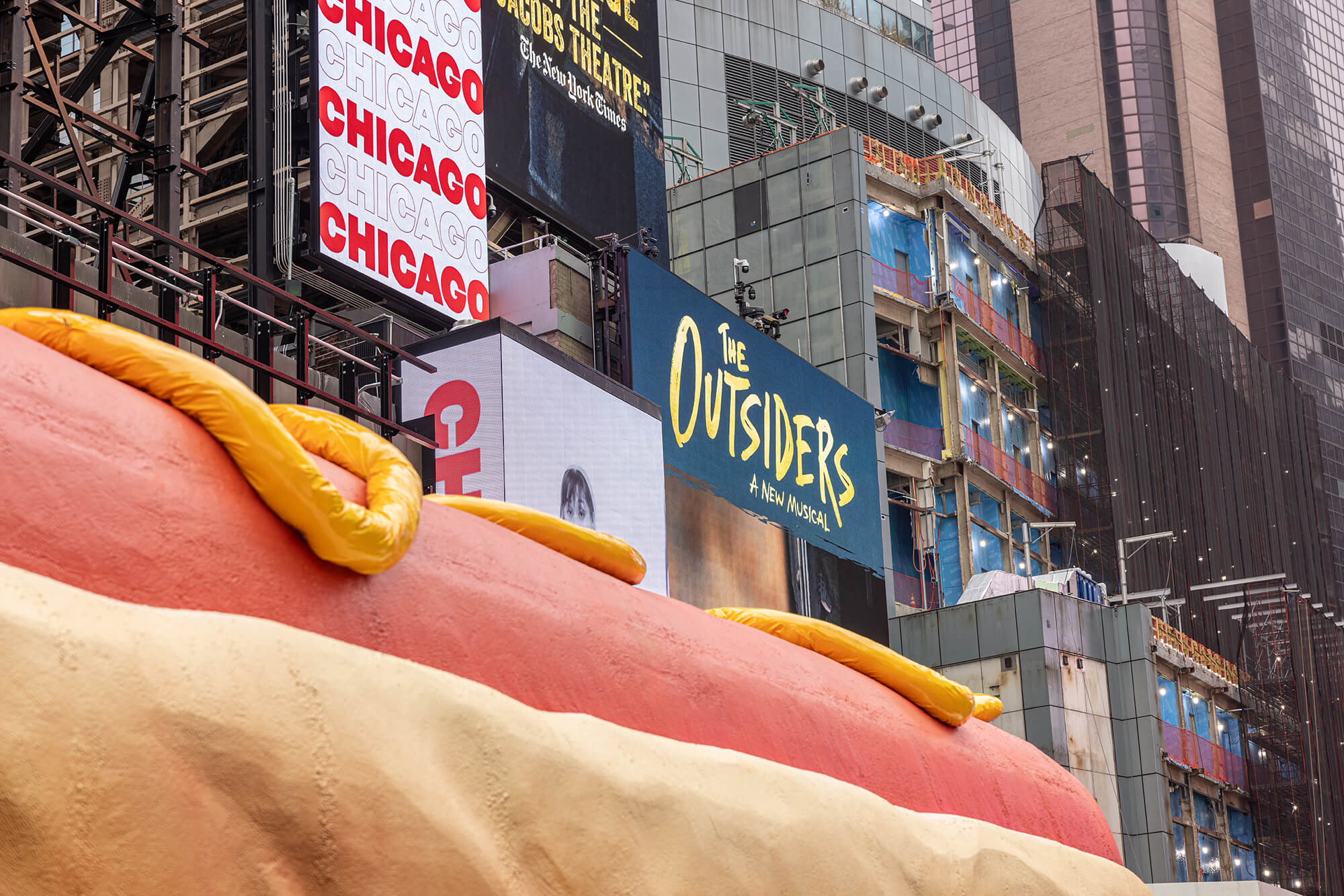 mustard dripping off Hot Dog in the City
