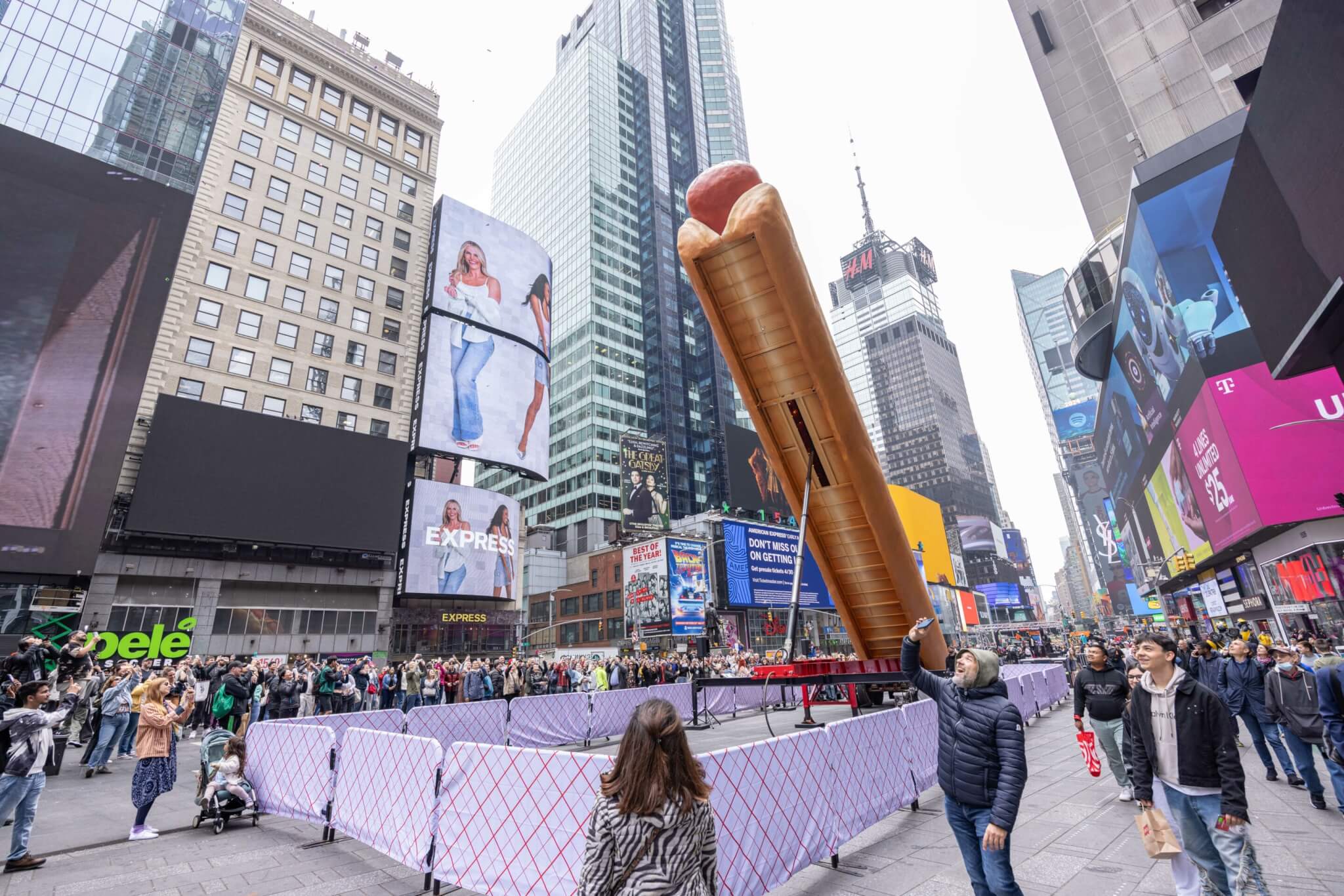 hot dog sculpture standing upright 